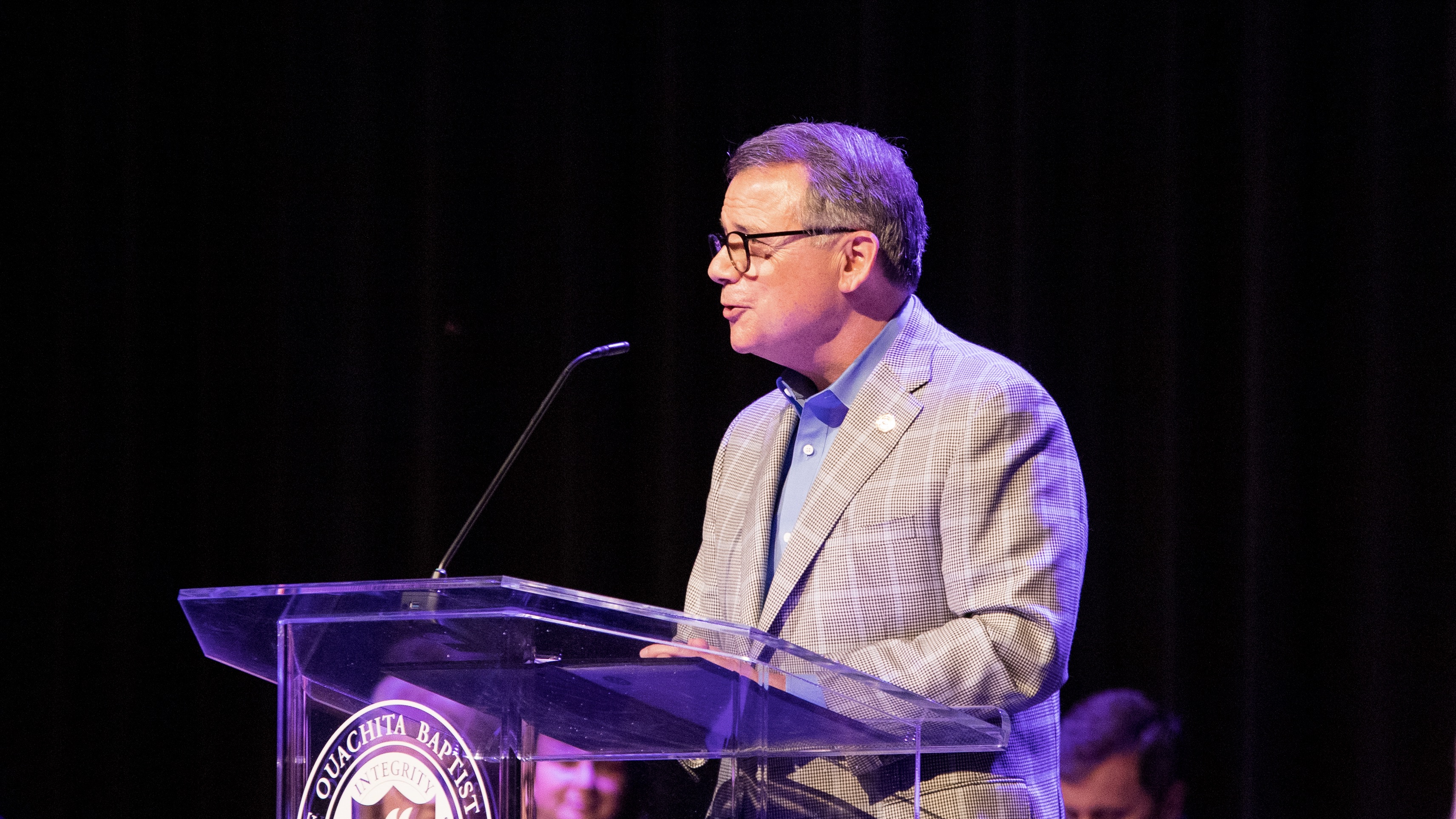 Dr. Ben Sells addresses students during ceremony honoring academic achievers