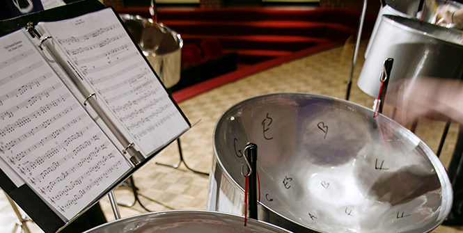 A student plays the steel drum