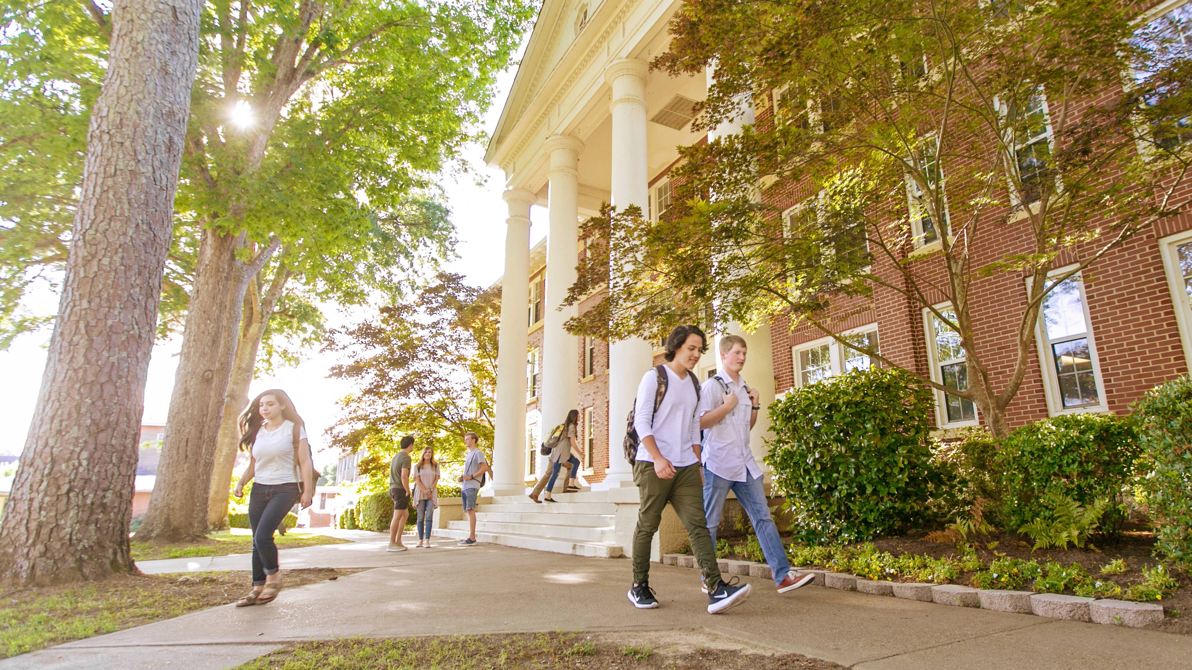 Students walking in front of Cone-Bottoms